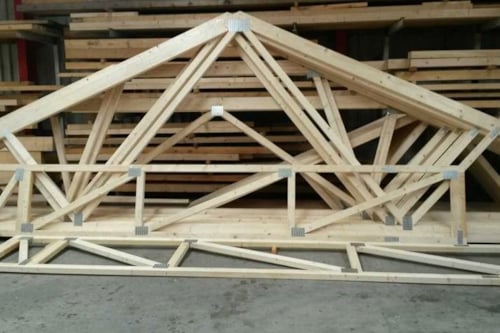 Wooden building materials connected with metal nail plates