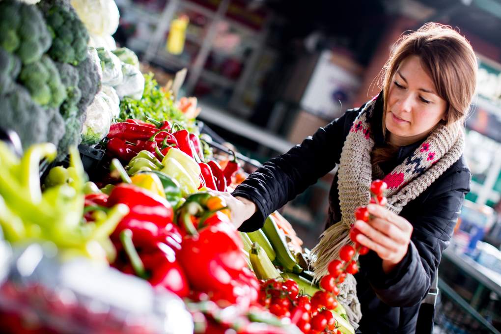 woman looking for food in a supermarket