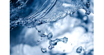 Close-up view of clear water splashing with droplets captured in motion against a blurred blue background